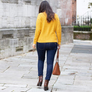Woman in bryanston jumper mustard