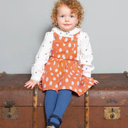Girl in little cub pinafore