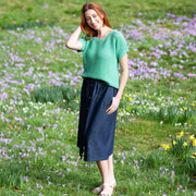 Woman in haven knit top green