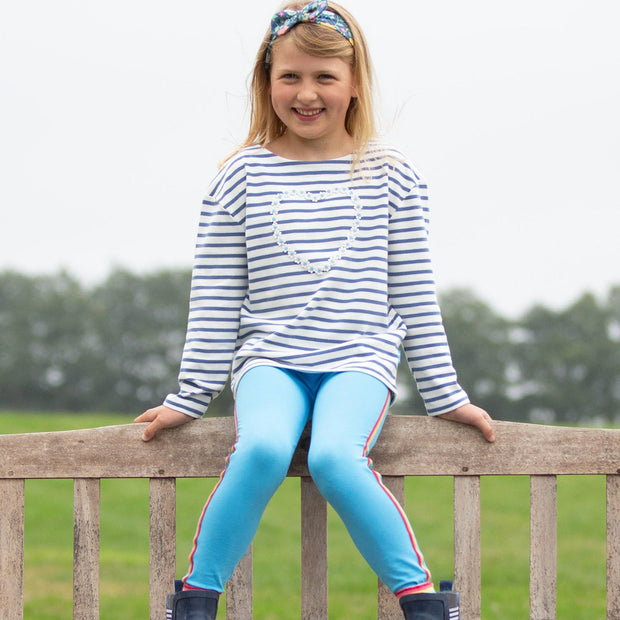 Girl in side stripe leggings