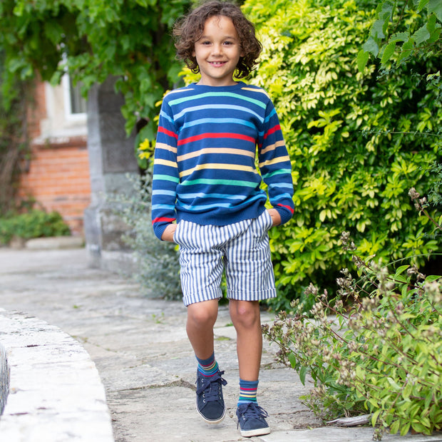 Boy in ticking turn-up shorts