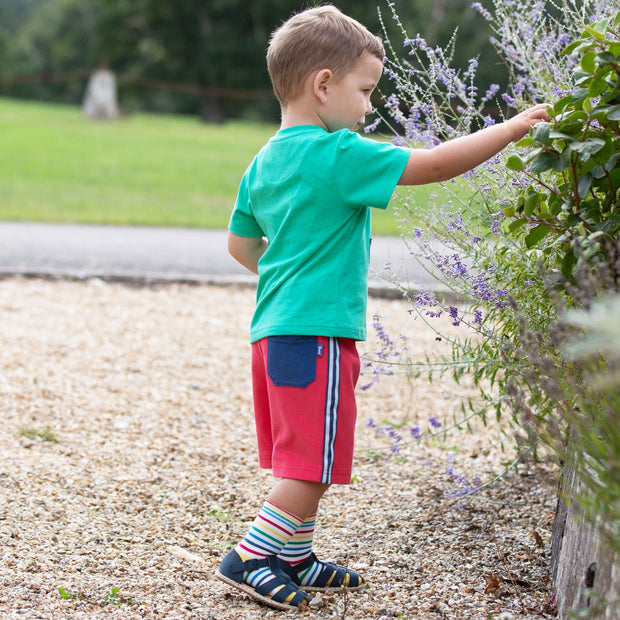 Boy in side stripe shorts