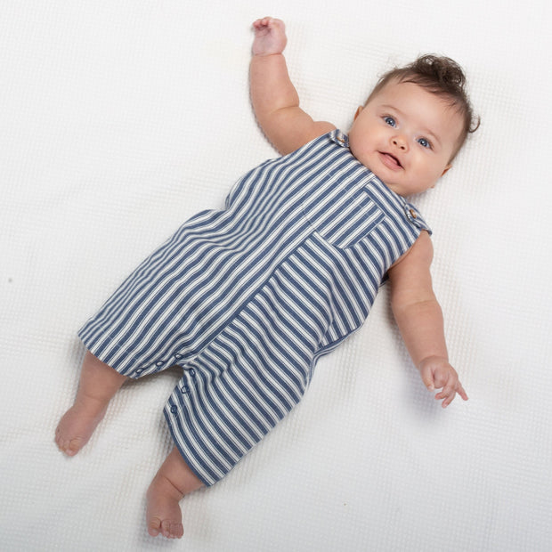 Baby in ticking romper dungarees
