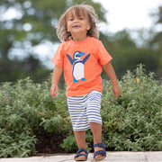 Boy in beach penguin t-shirt