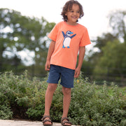 Boy in beach penguin t-shirt
