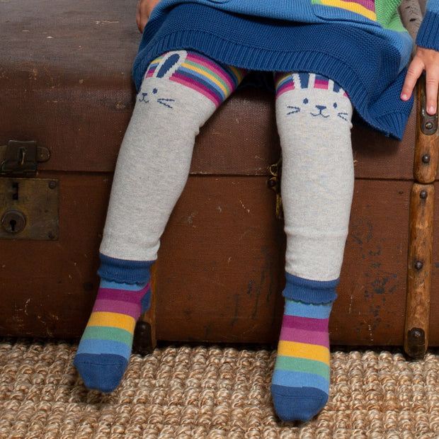 Girl in rainbow flower socks