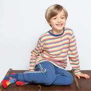 Boy in rainbow stripe t-shirt