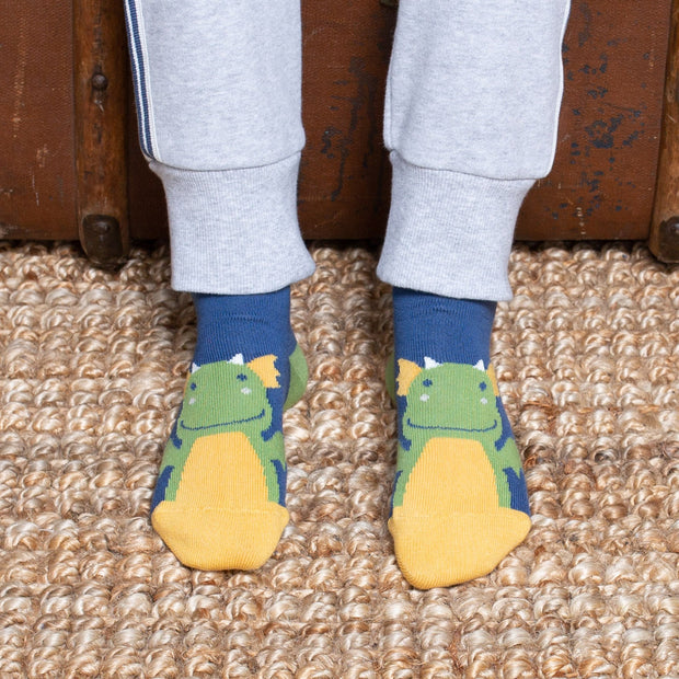 Boy in little dragon socks