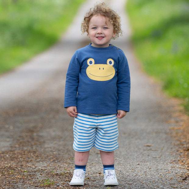 Boy in froggy sweatshirt