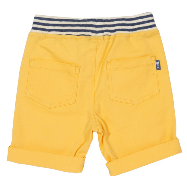Boy in mini yacht shorts yellow