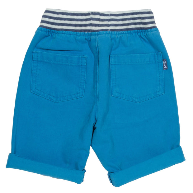 Boy in mini yacht shorts