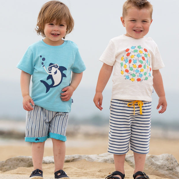 Boy in wonder whale shorts