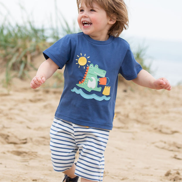 Boy in mini corfe shorts