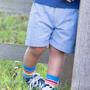 Boy in mini ticking shorts