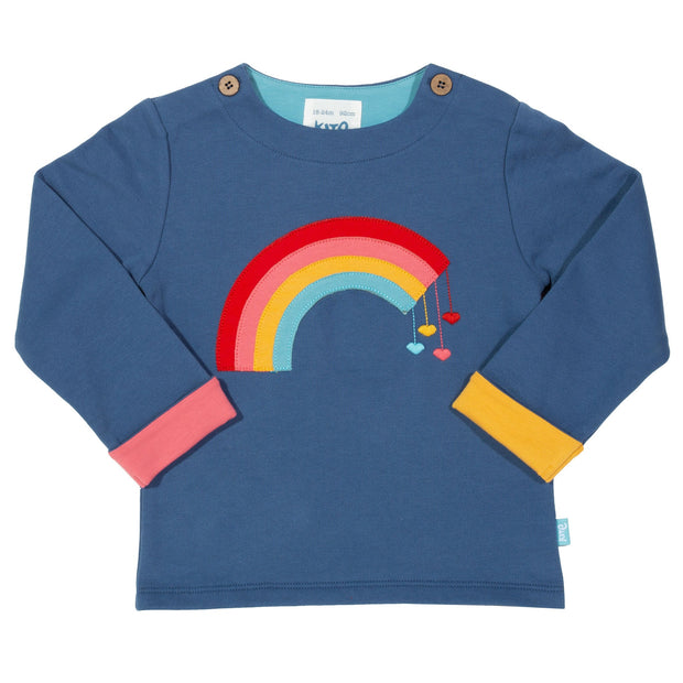 Girl in rainbow sweatshirt